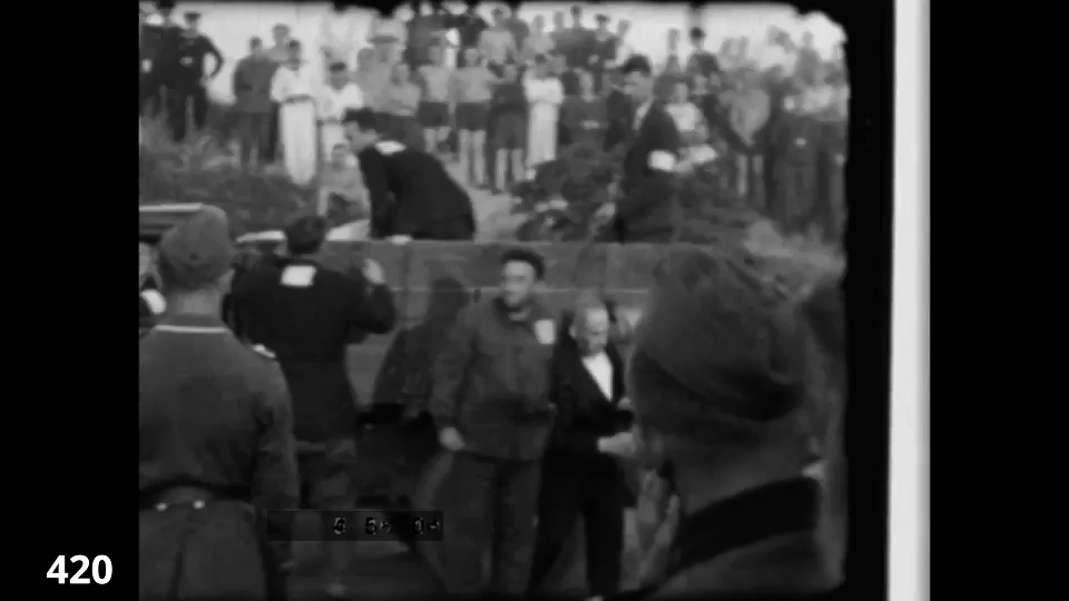 Screenshot from the Wiener Film mass execution in Liepaja 1942 fc 0420 - POV towards Lorry - delinquents are forced off car